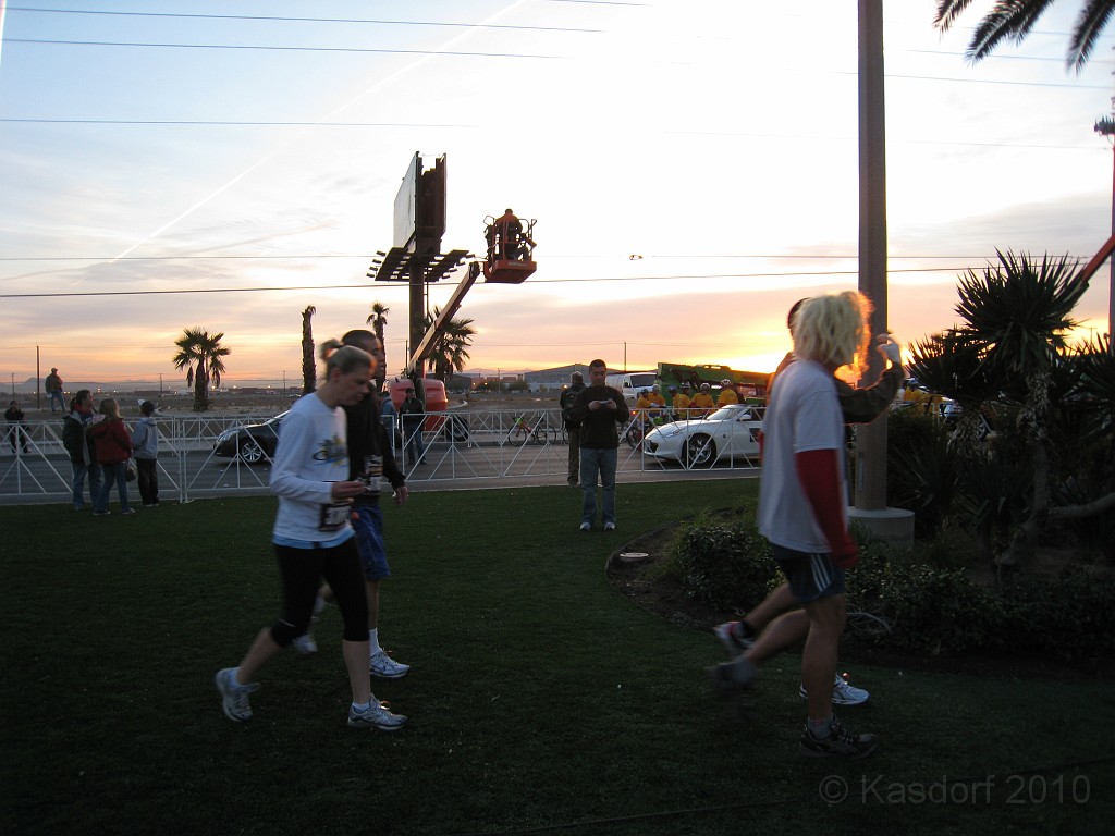 Las Vegas 2010 - Marathon 0071.JPG - The 2010 Las Vegas Fire - Ice and Sweat Tour. Half Marathon, Red Rock Canyon, Casinos, Valley of Fire.... and buffets!Runners start straggling in, with the sun just peeking over the horizon.